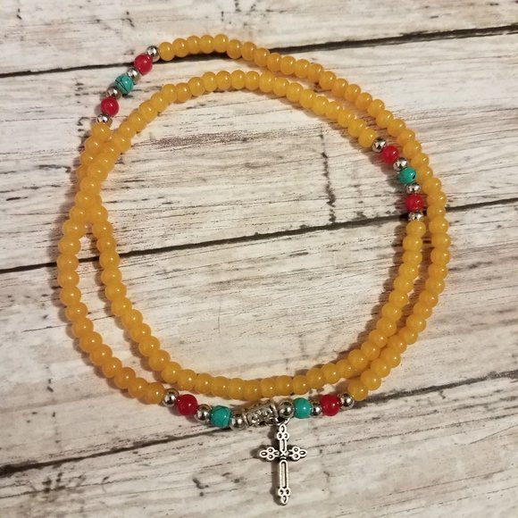 Yellow stretchy bracelet with cross charm - Picture 1 of 5